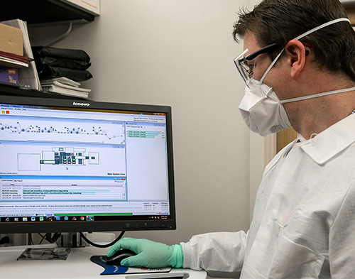 Doctor reviewing digital records with a patient, showing healthcare IT solutions.