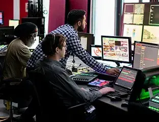 One team works on a computer, representing a Managed IT Service for Ciber IT Solutions.